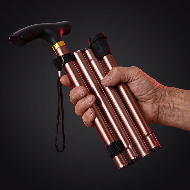 Adjustable Folding Walking Cane - Rose Gold, Folded in Hand