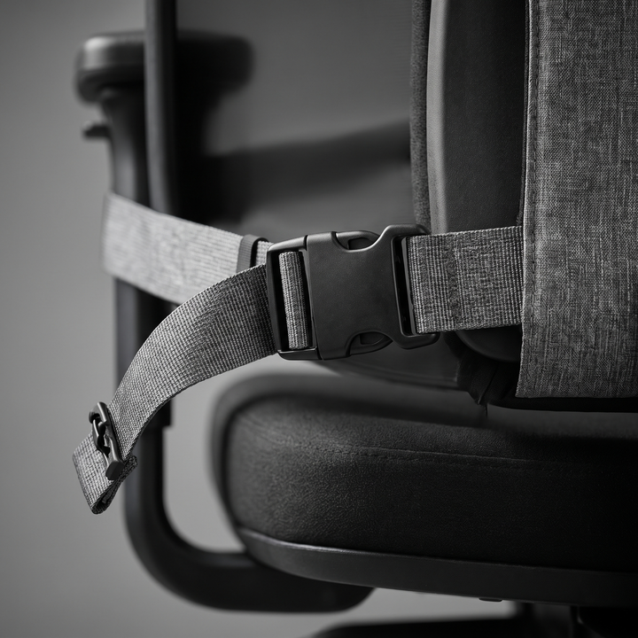 Close-up of adjustable strap attachment on lumbar cushion