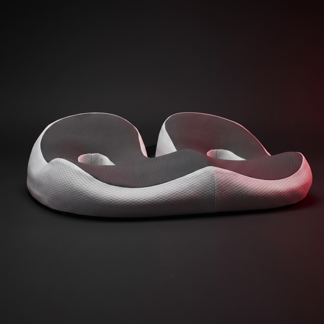 Ergonomic memory foam donut seat cushion with open-center cutout for pressure relief