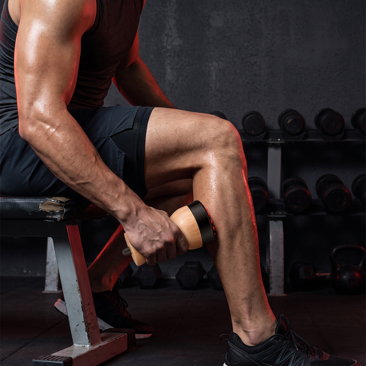 Gua Sha Massage Tool Used on Calf Muscle Post-Workout