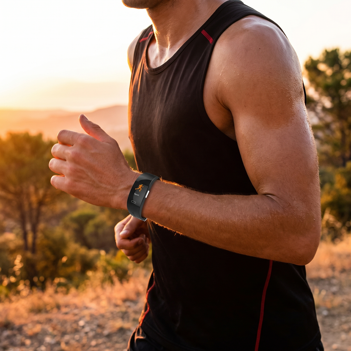 Athlete running outdoors wearing a smart fitness activity tracker band