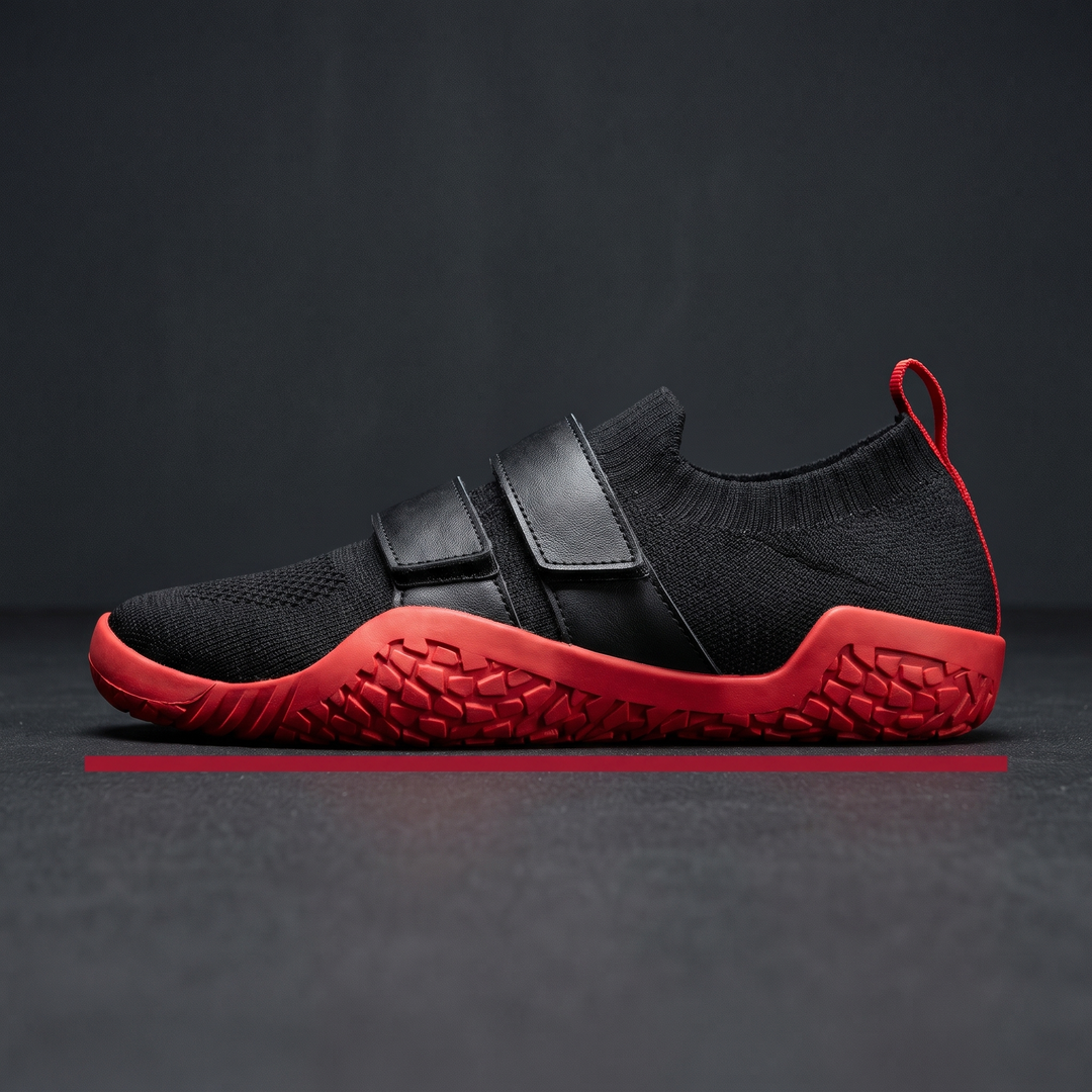 Side profile view of hard sole weightlifting shoe with hook-and-loop strap