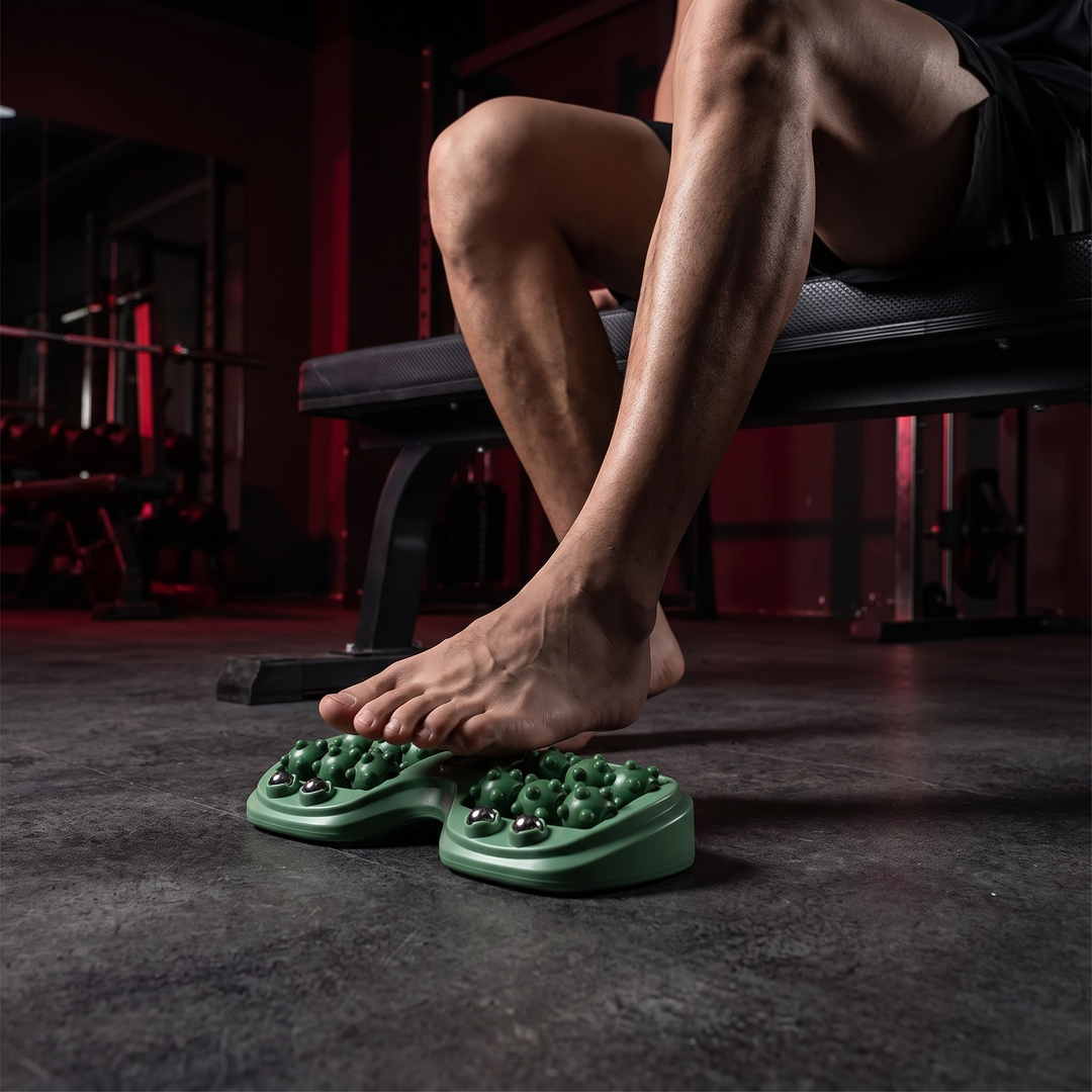 PHYSIOATHLETX Ergonomic Foot Massage Roller in use - green - rolling foot for muscle recovery
