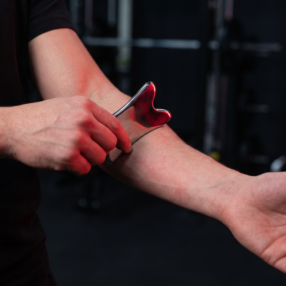 Stainless Steel Gua Sha Tool in Use - Forearm Muscle Recovery