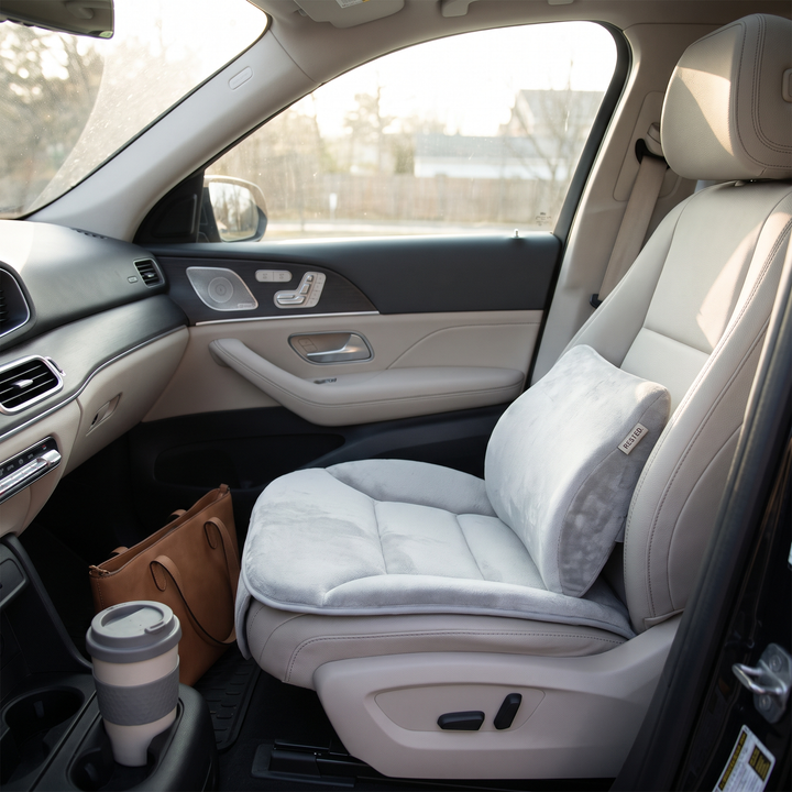 Light grey memory foam seat and lumbar cushion set installed on a car passenger seat