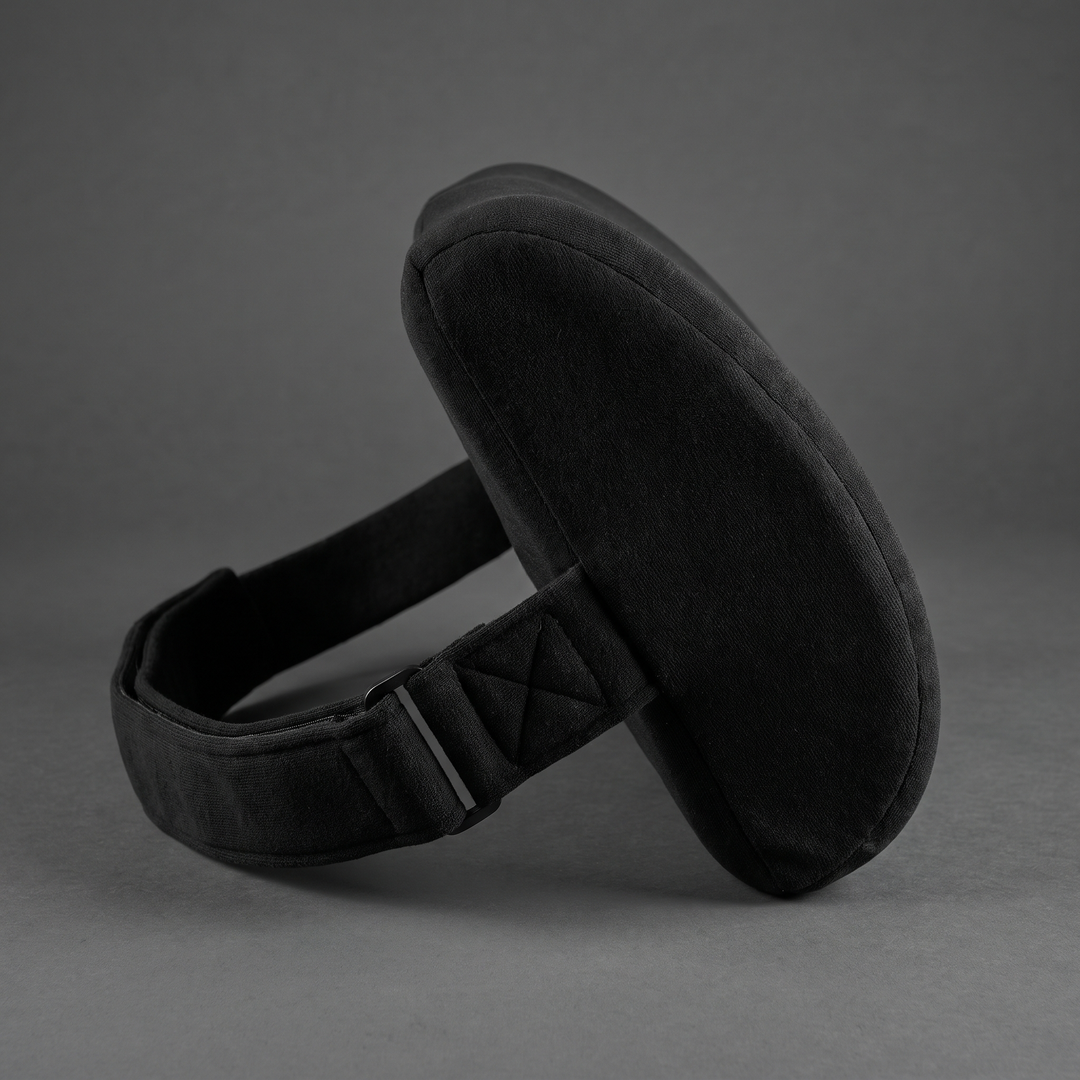 Black ergonomic lumbar support cushion with adjustable strap