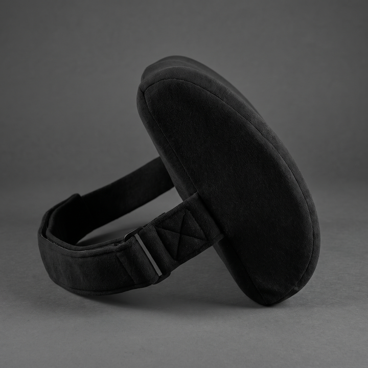 Black ergonomic lumbar support cushion with adjustable strap