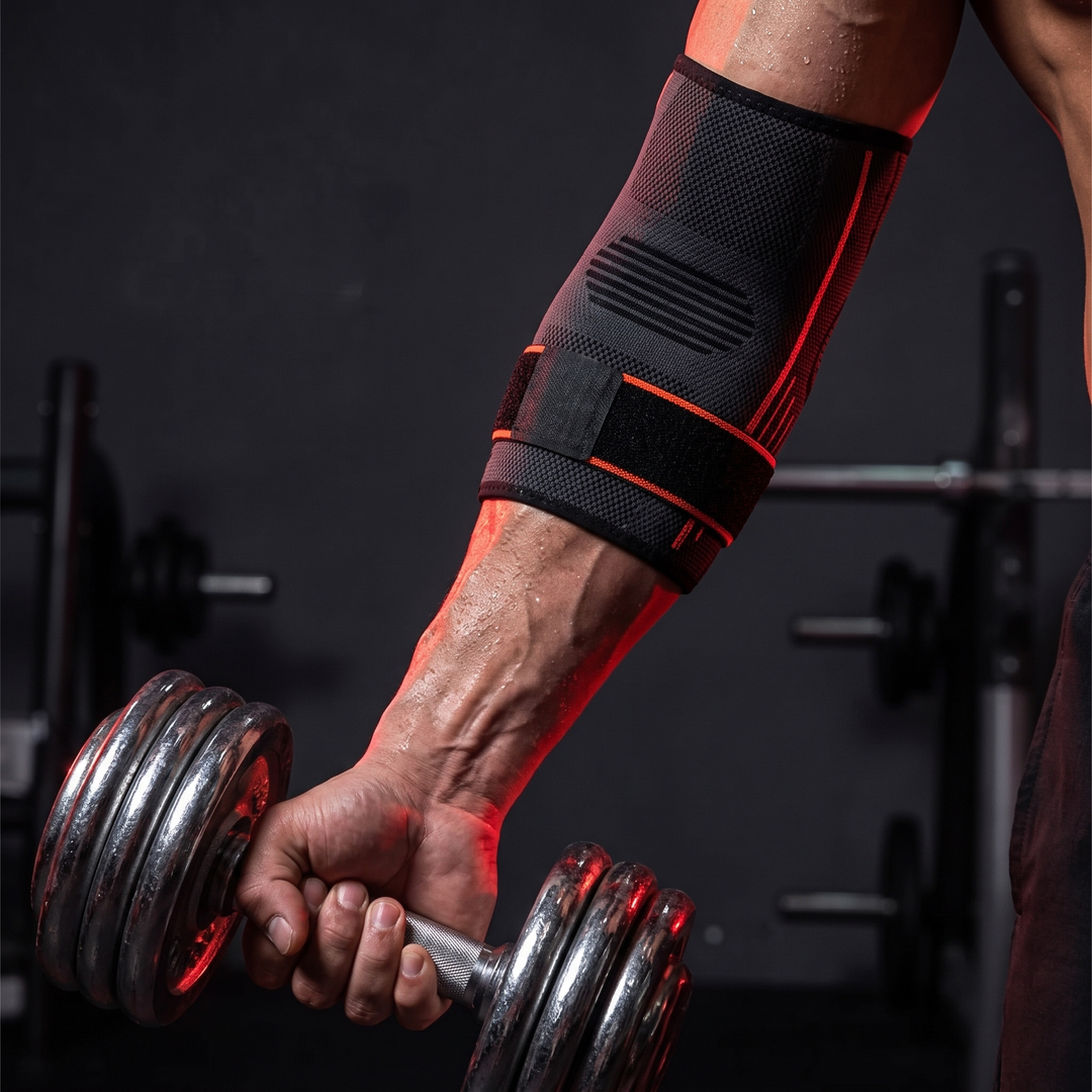 Adjustable Elbow Compression Sleeve — worn during dumbbell grip training