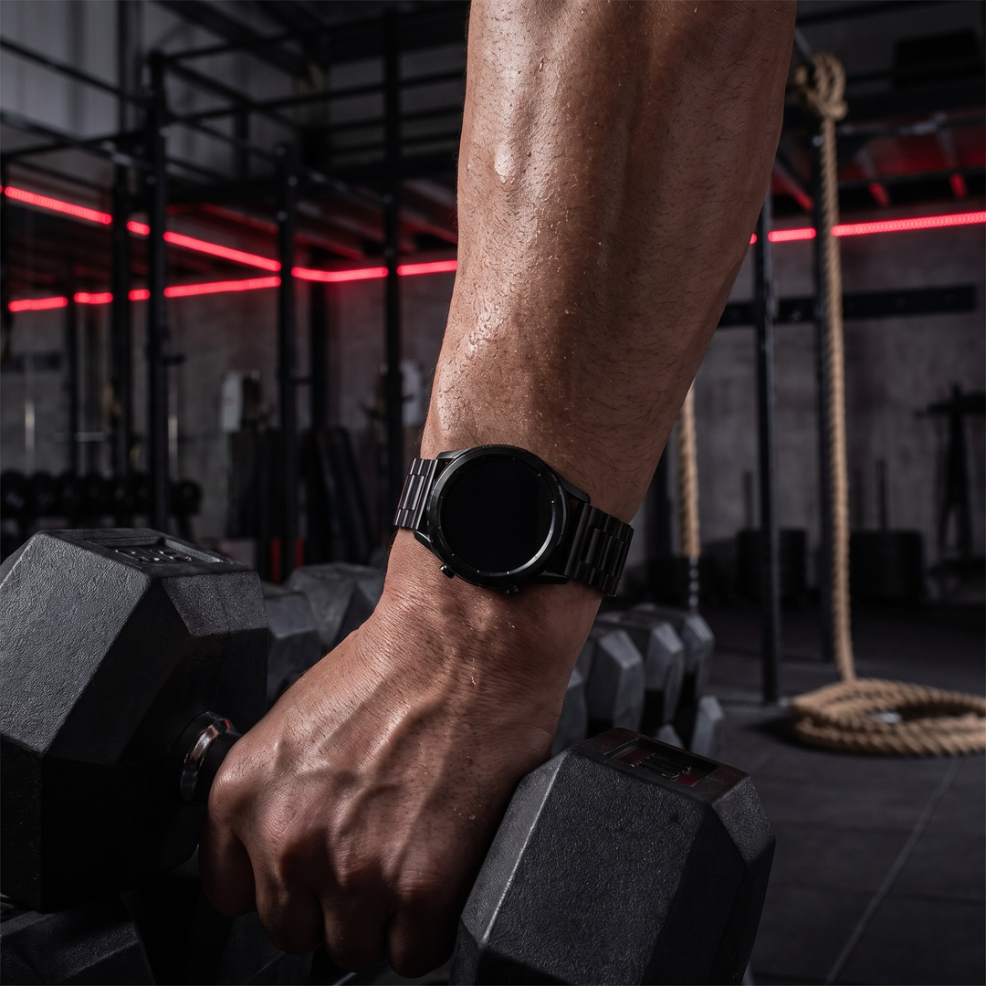 PHYSIOATHLETX smart fitness watch worn during a dumbbell workout, black steel link band