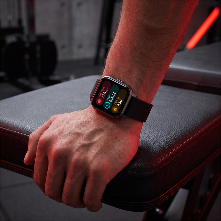 PHYSIOATHLETX smart fitness watch worn on wrist close-up, black silicone band
