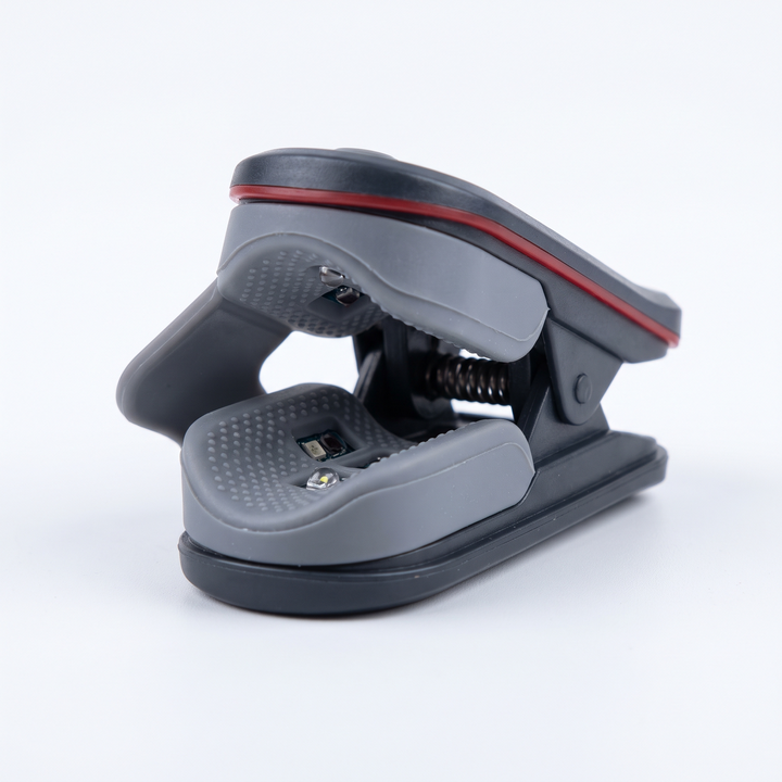 Close-up of pulse oximeter finger clip sensor with soft silicone padding