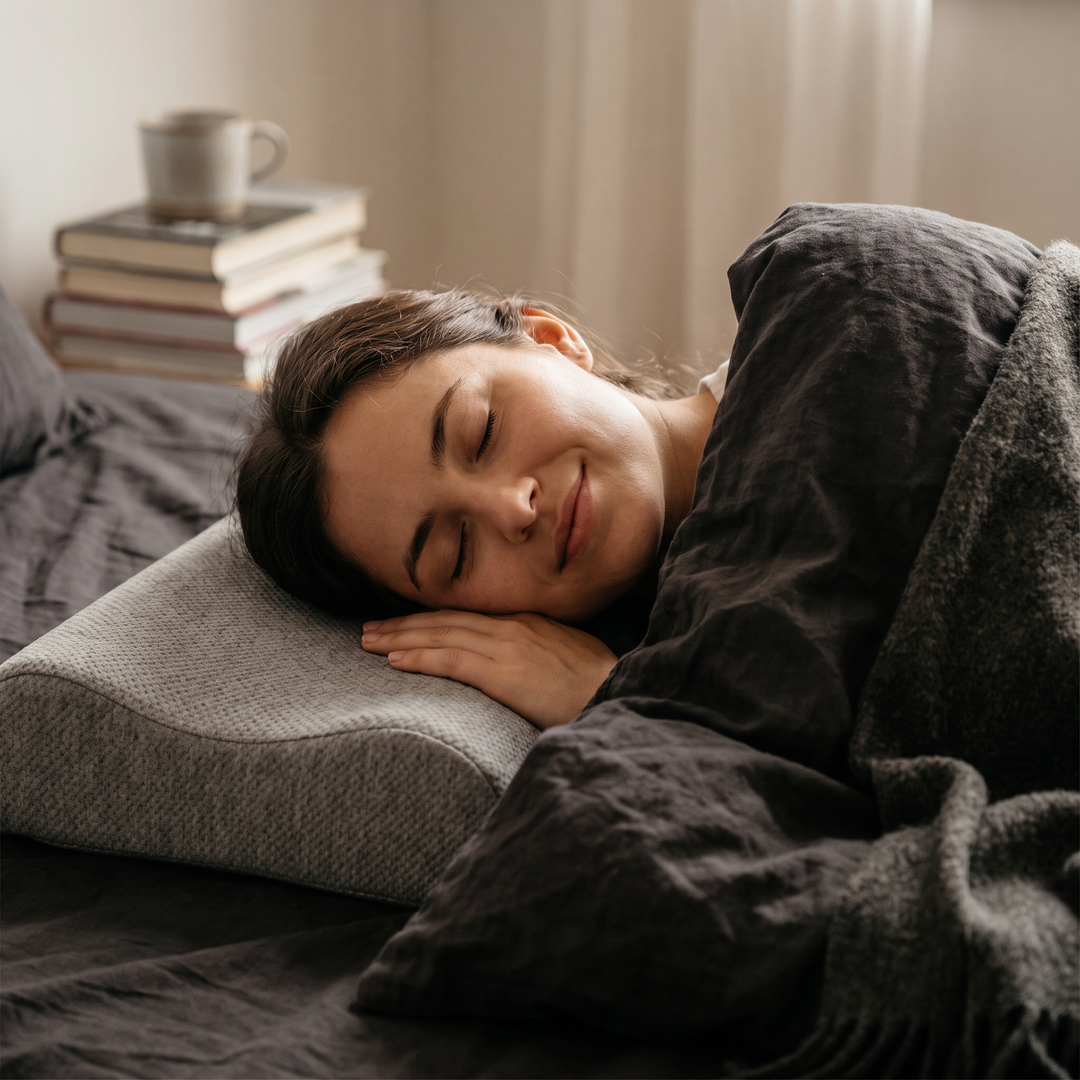 Close-up of side sleeper resting peacefully on grey contour pillow