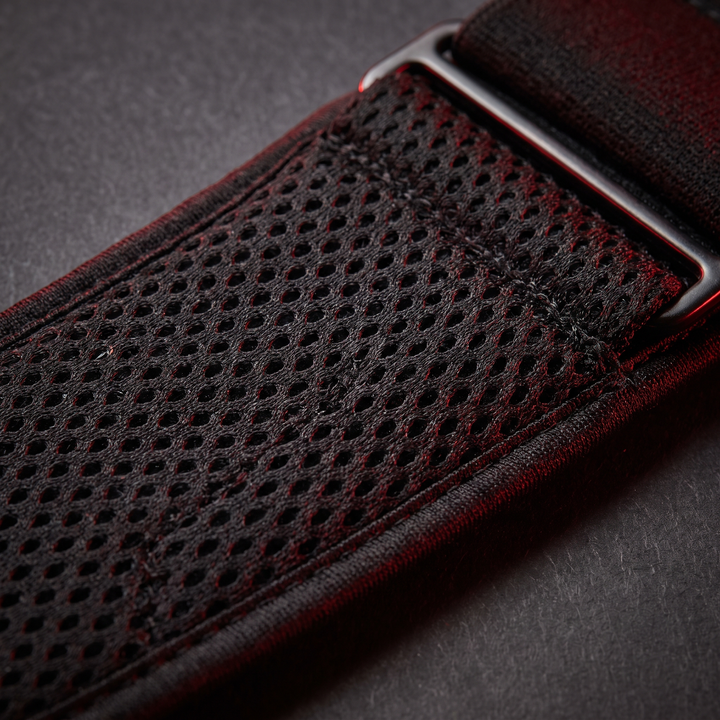 Close-up of breathable ergonomic mesh fabric on PHYSIOATHLETX black waist support belt