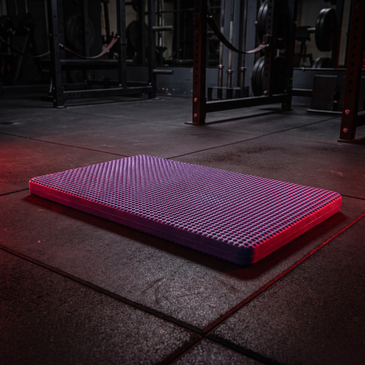 Three-quarter angle view of purple PHYSIOATHLETX stability cushion balance pad