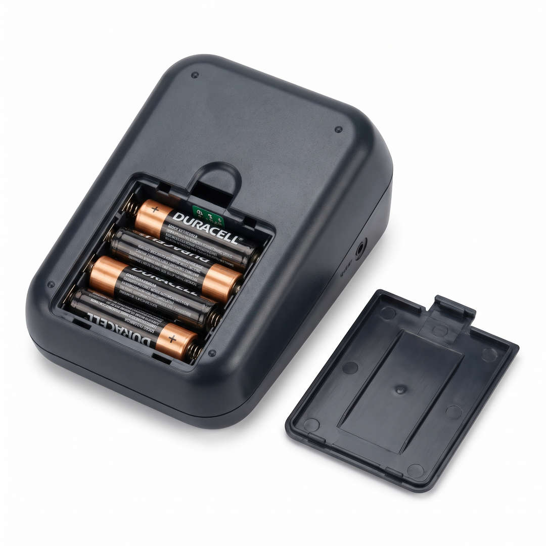 Blood pressure monitor battery compartment for portable home use