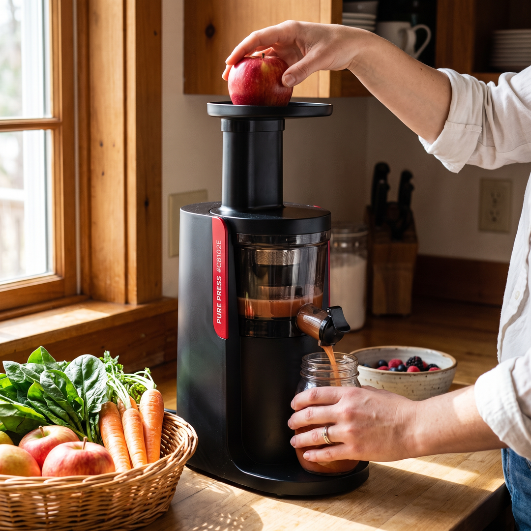 Professional Cold Press Juicer Slow Masticating Juicer - feeding whole apple into chute