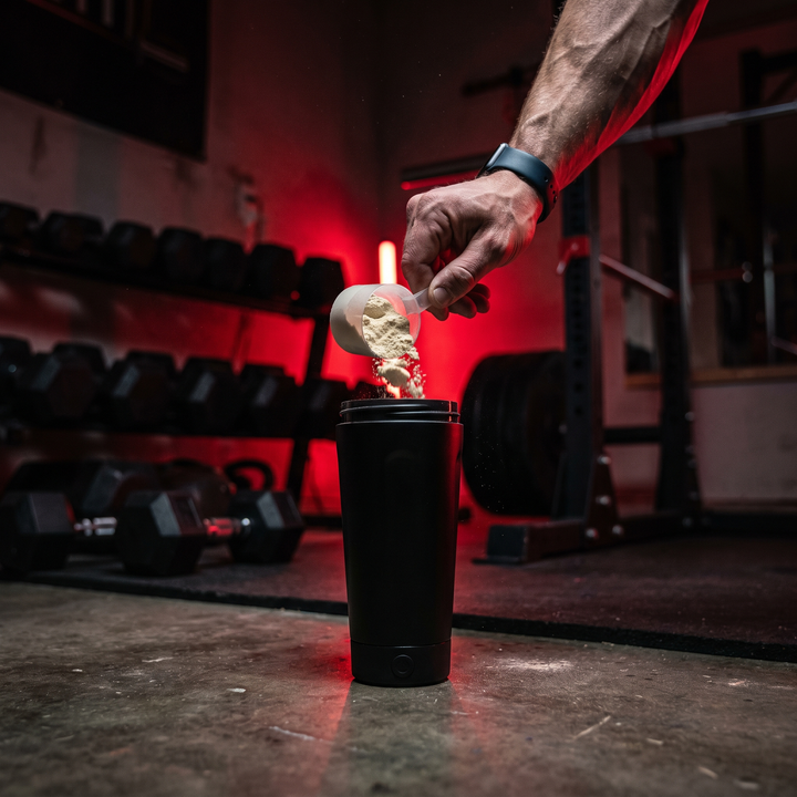 Electric Protein Shaker Bottle 650ml - Black - pouring protein powder lifestyle shot