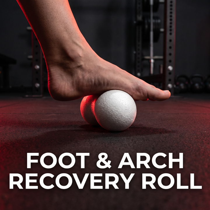 Close-up of foot rolling PHYSIOATHLETX white peanut massage ball for arch recovery