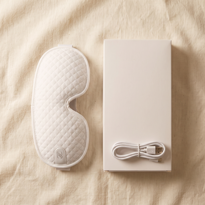 PhysioAthletX 3D Compression Eye Massager - packaging flat lay with charging cable