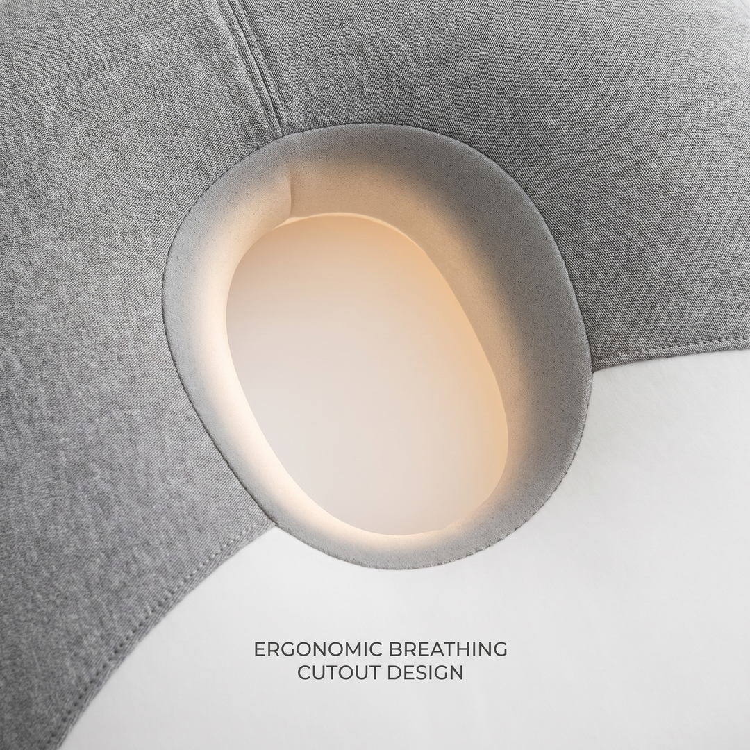 Ergonomic breathing cutout design on a face-down massage headrest cushion