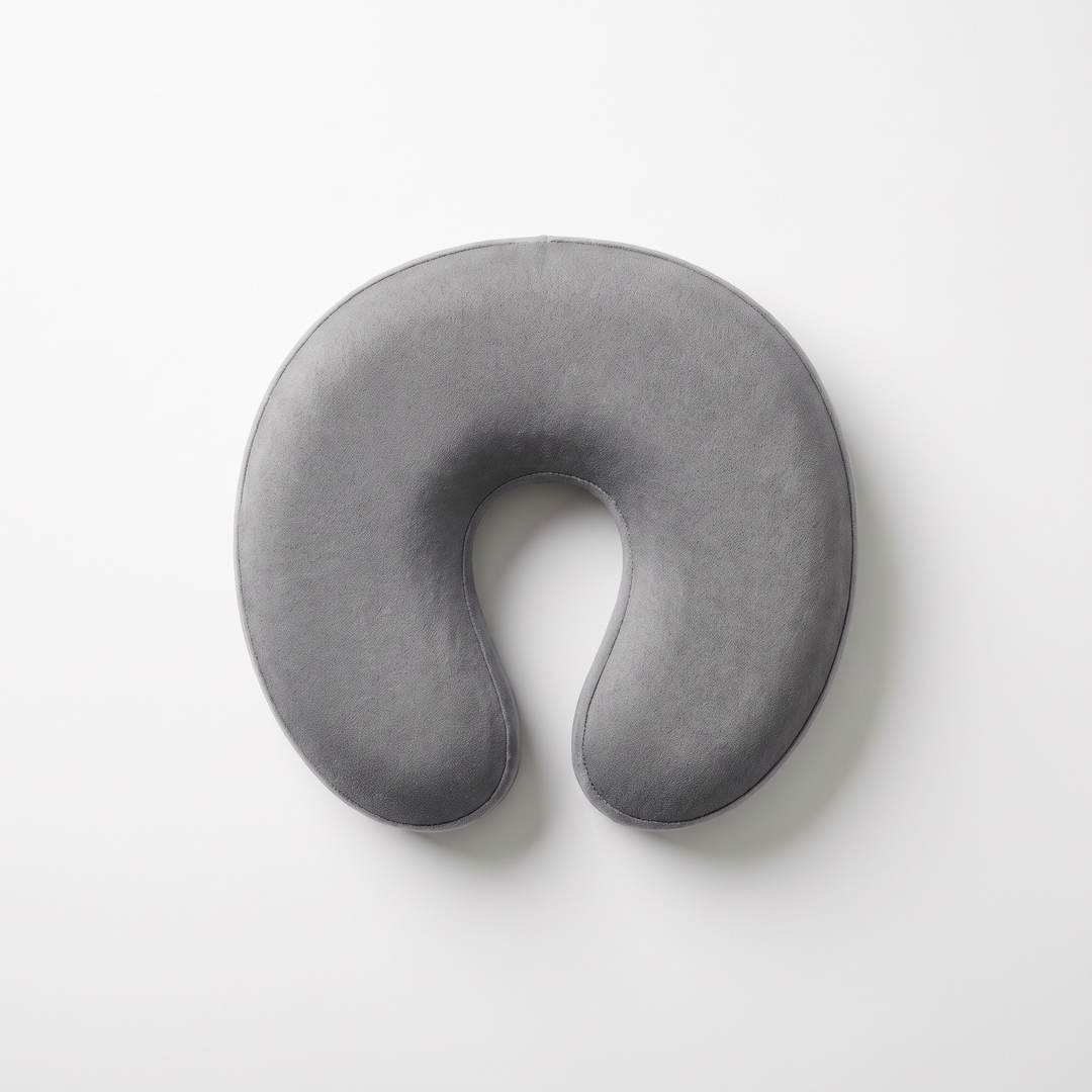 Gray memory foam massage table headrest cushion, top-down flat lay