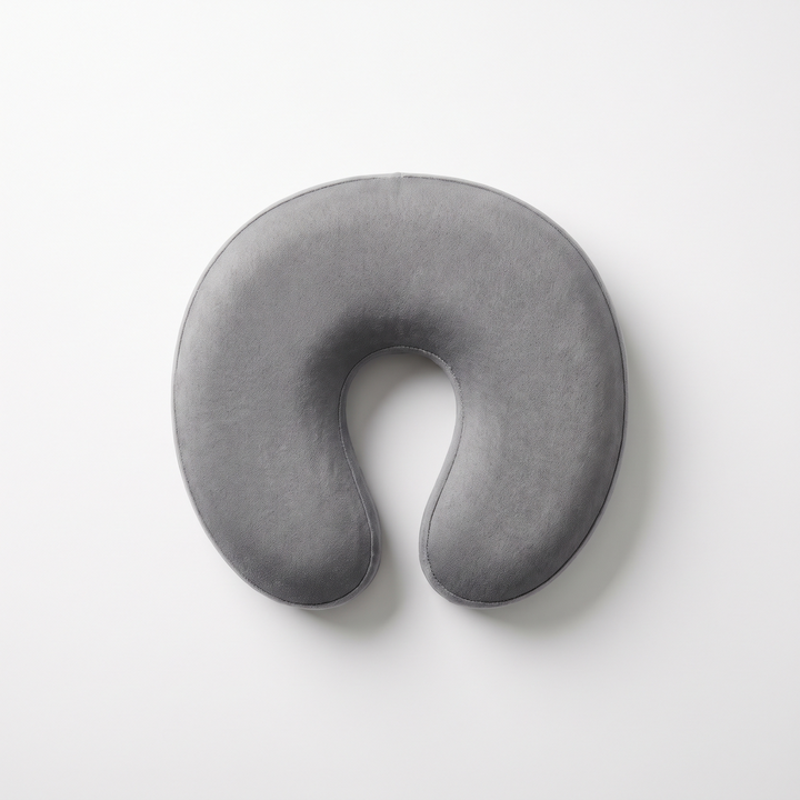 Gray memory foam massage table headrest cushion, top-down flat lay