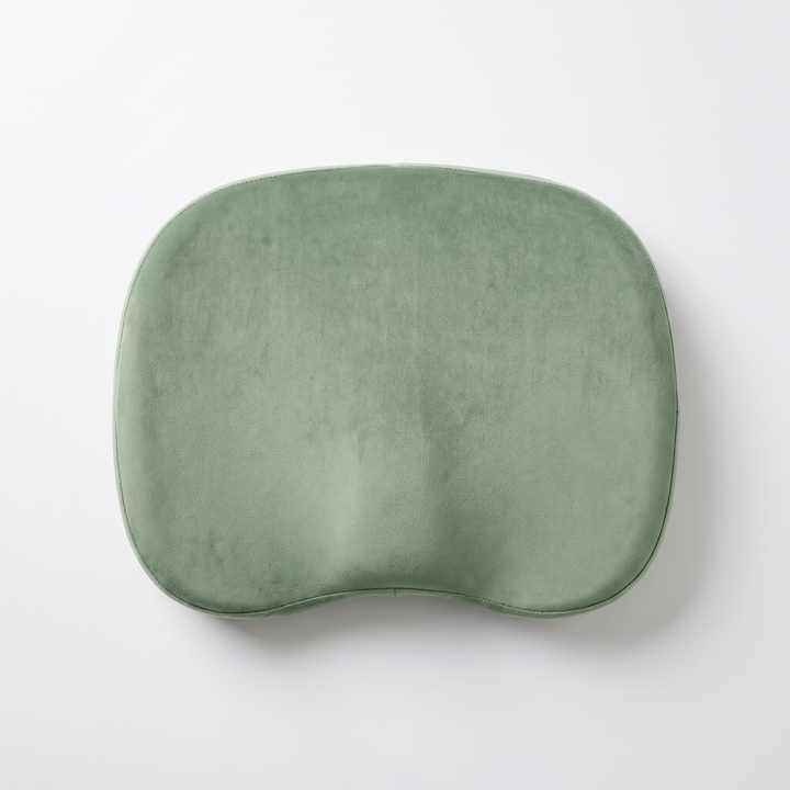 Sage green memory foam massage table headrest cushion, top-down flat lay