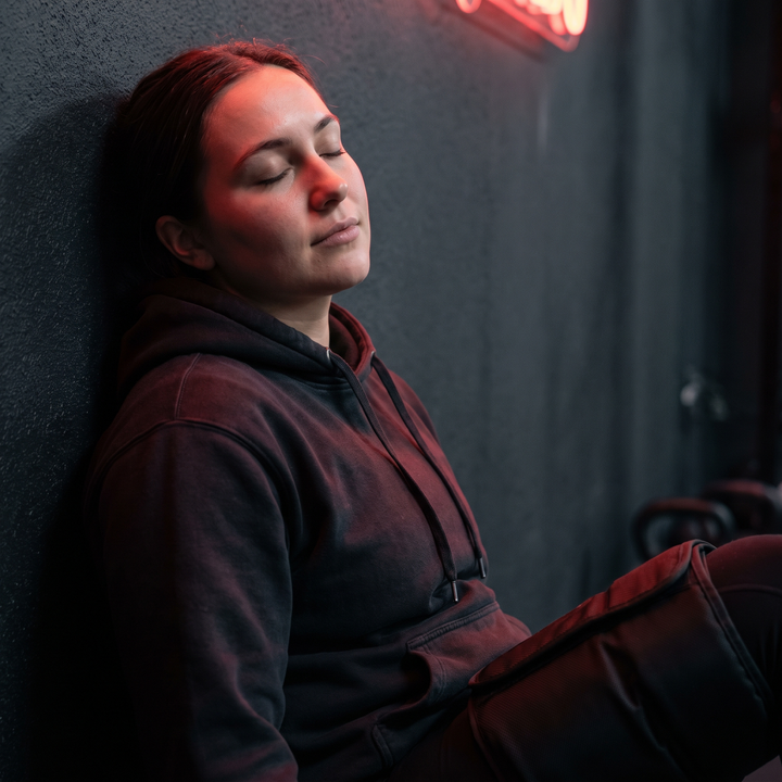 Relaxed athlete during a full-leg compression recovery session