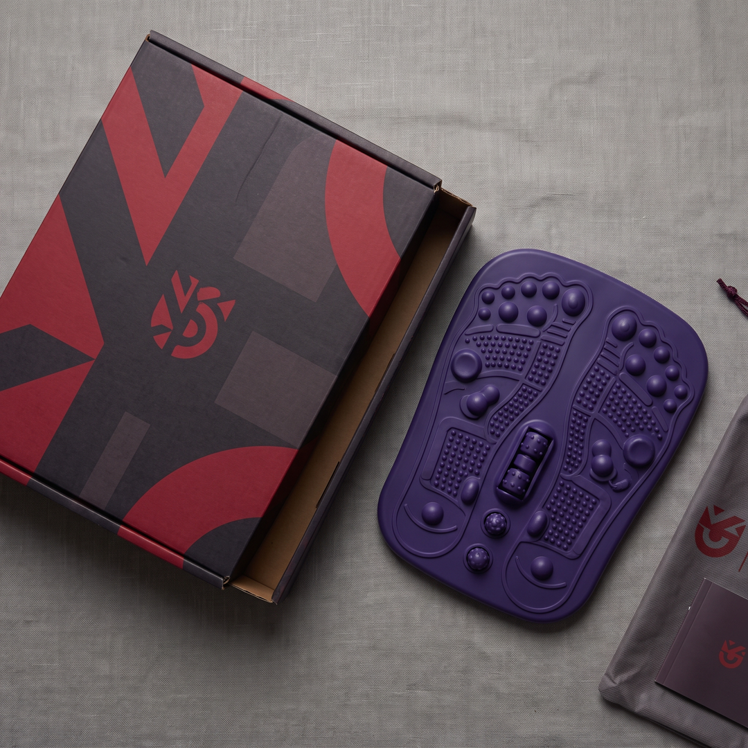 Purple foot massage board with retail packaging box
