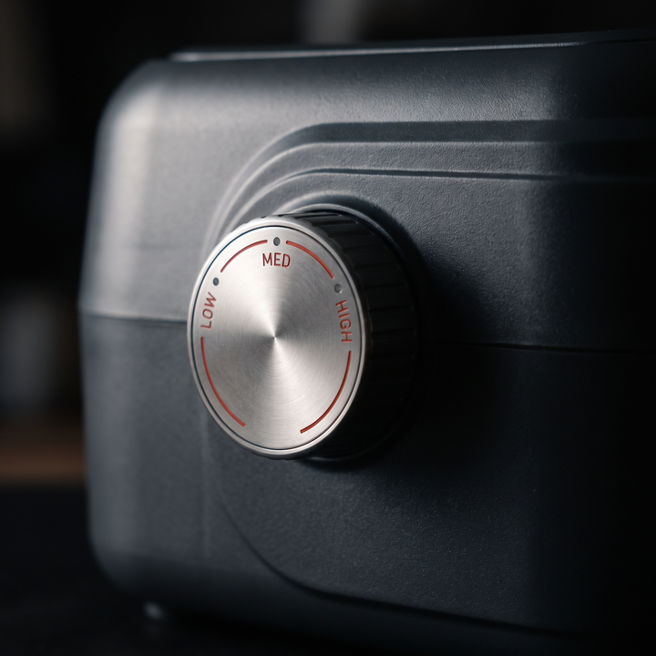Close-up of 3-level pressure control dial on compression recovery device