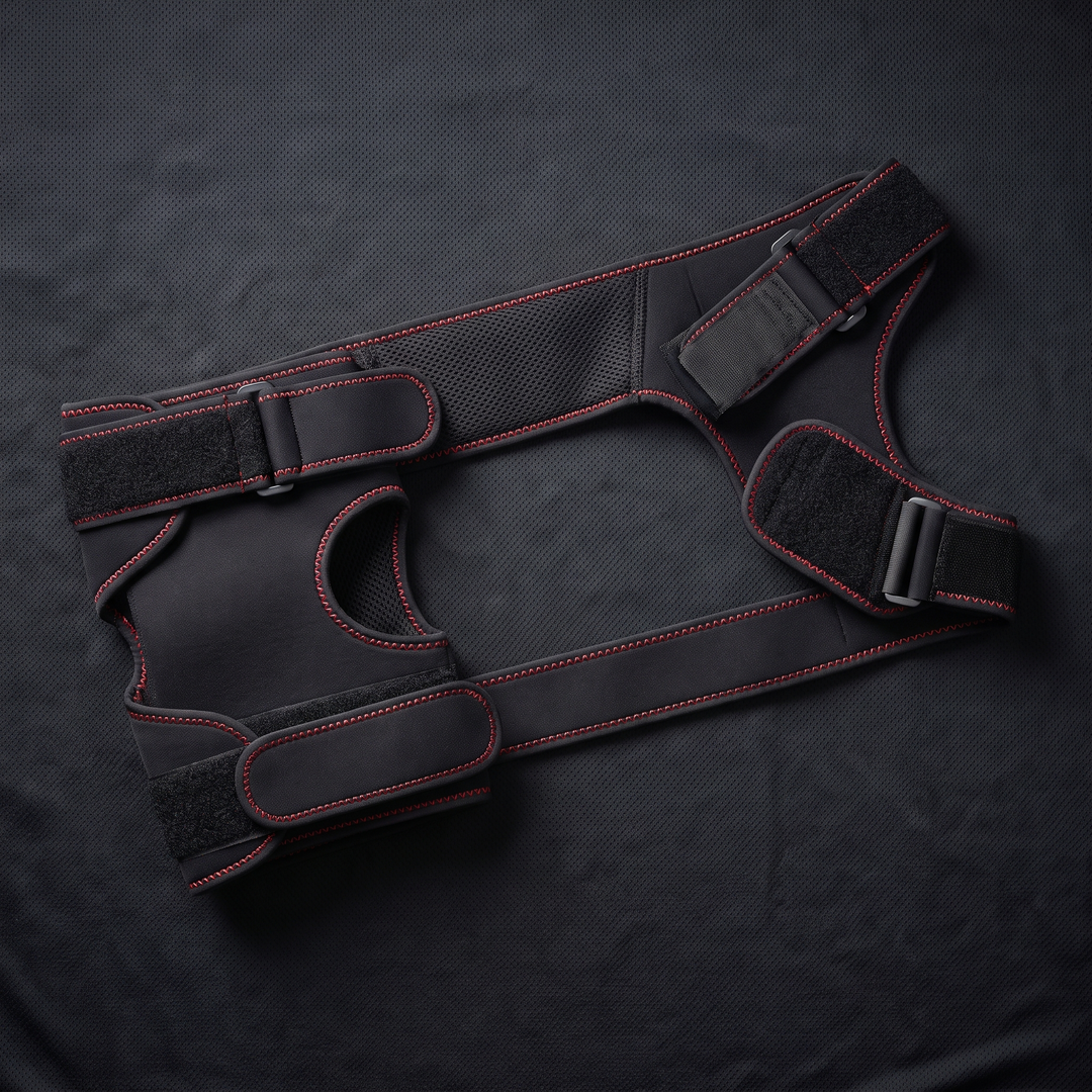 Flat lay of adjustable compression wrap for knee and shoulder recovery