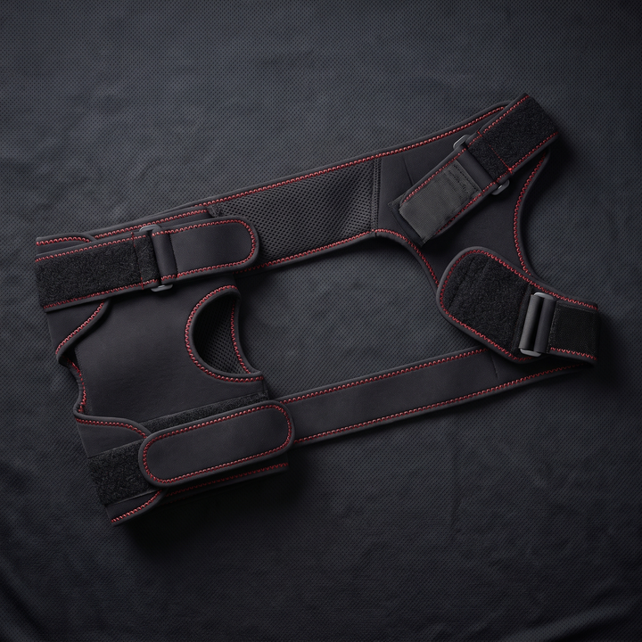 Flat lay of adjustable compression wrap for knee and shoulder recovery