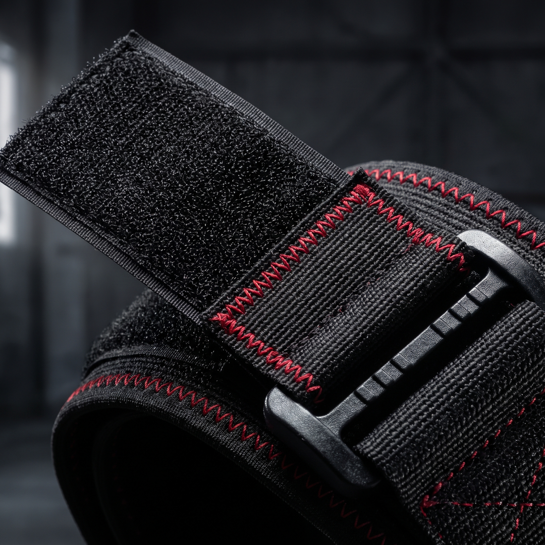Close-up of adjustable strap and fastening on compression recovery wrap