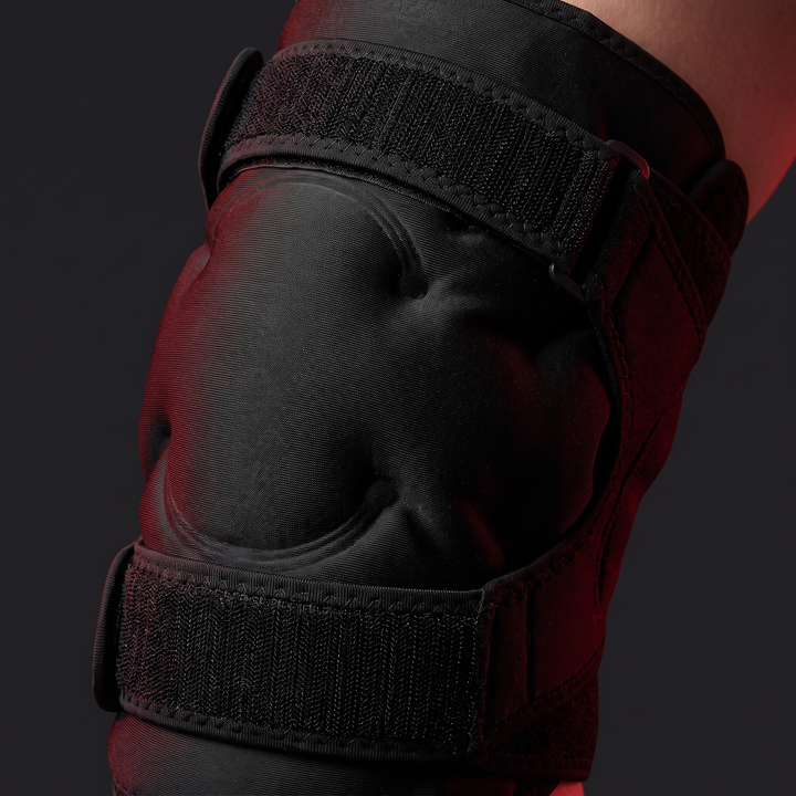 Black reusable knee ice pack wrap - flexible gel pack close-up view