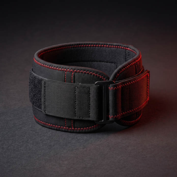 Black adjustable knee support strap with red accent stitching for basketball, running, and gym training