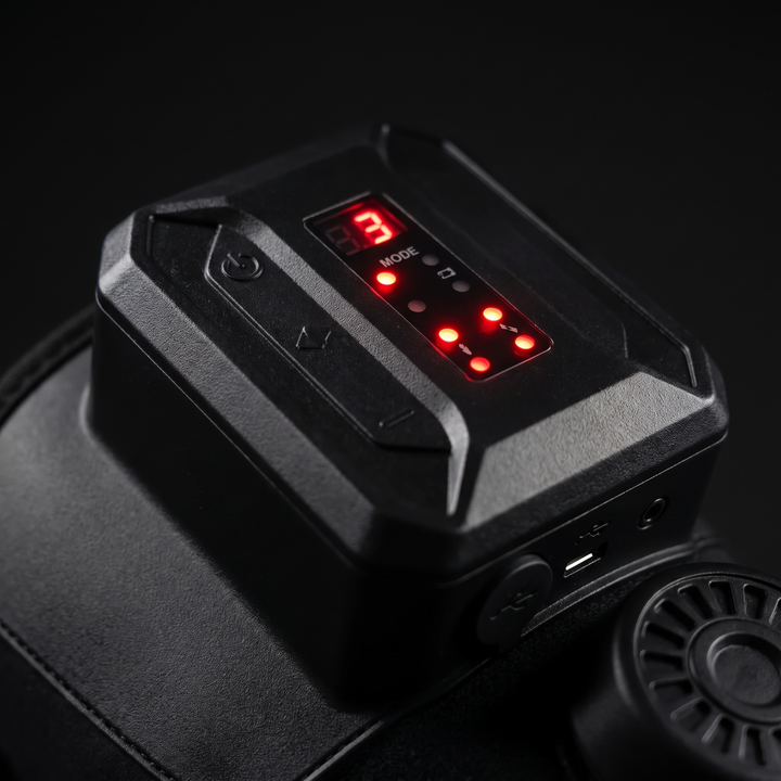 Close-up of LED mode indicator lights on the knee recovery wrap