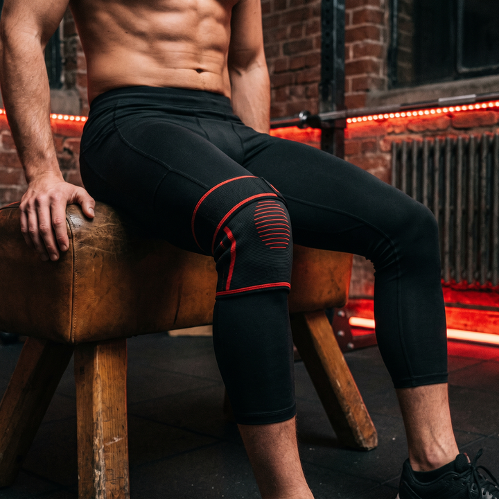 Athlete wearing the knee recovery wrap during a post-workout recovery session