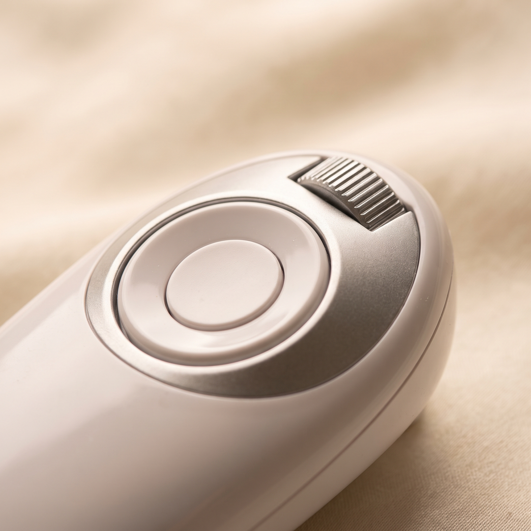Close-up of the control button and light mode dial on the PHYSIOATHLETX LED Face &amp; Neck Light Therapy Mask