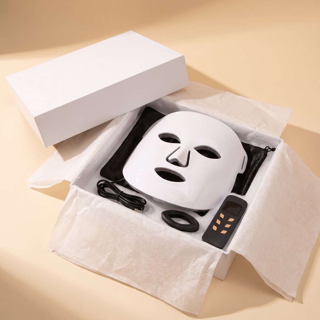Professional LED Face &amp; Neck Light Therapy Mask unboxing view, mask nestled in retail packaging