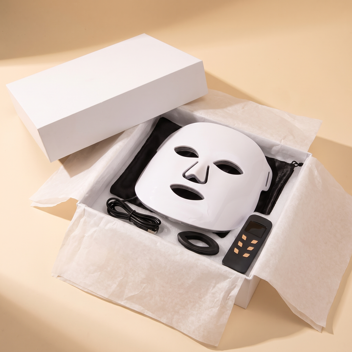 Professional LED Face &amp; Neck Light Therapy Mask unboxing view, mask nestled in retail packaging
