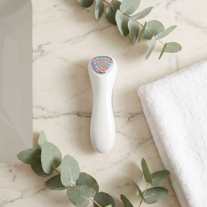 Professional LED Light Therapy Face Neck Massager - top-down flat lay styling