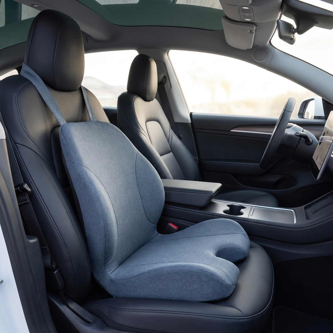 Ergonomic lumbar support seat cushion, blue gray, mounted on a car driver seat