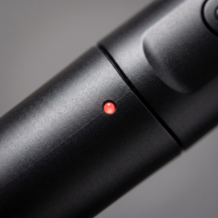 Close-up of the LED power indicator light on the PHYSIOATHLETX handheld muscle relaxation pen