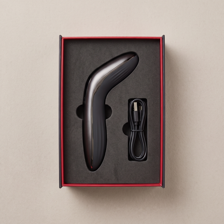 PHYSIOATHLETX muscle relaxation pen packaging box, open, showing pen and USB charging cable in foam insert