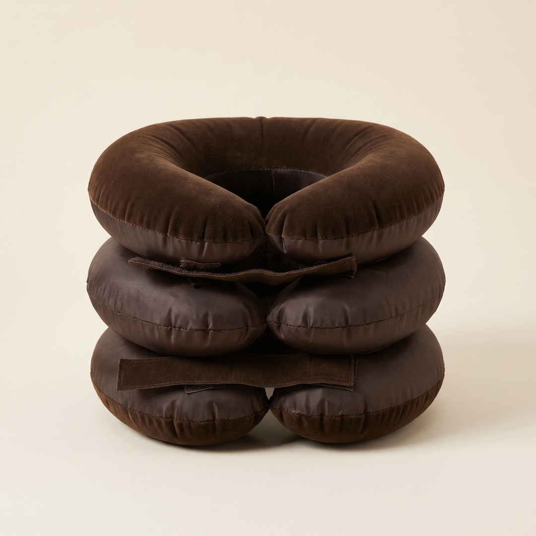 Front view of brown inflatable neck and shoulder relaxation support, adjustable wraparound fit