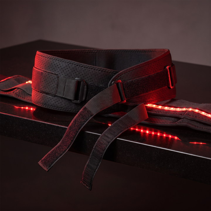 Black LED heat wrap recovery belt three-quarter angle hero shot with straps unfastened