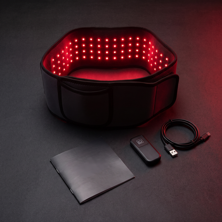 Full kit flat lay: heat wrap belt, charging cable, remote, and manual