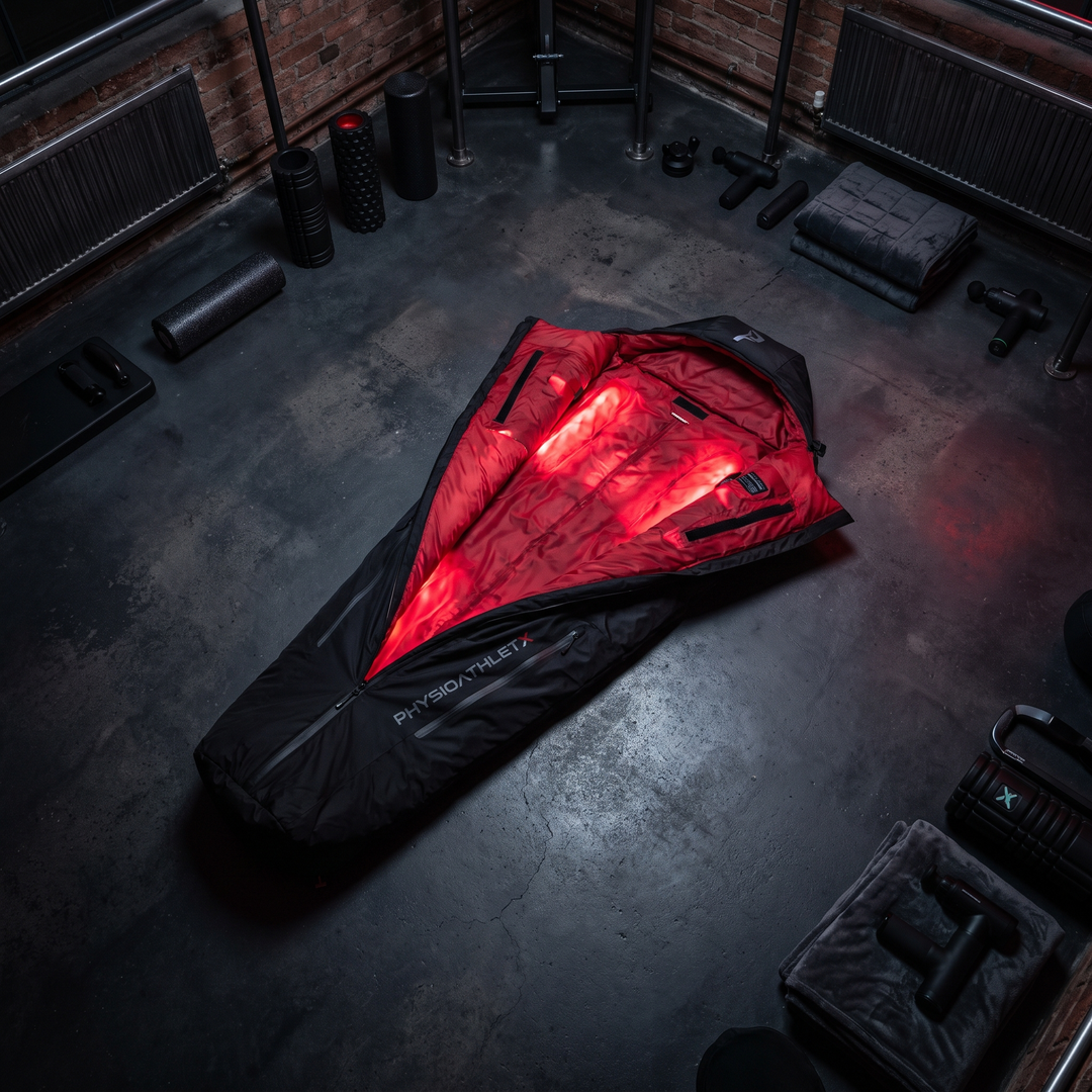 PHYSIOATHLETX Red Light Recovery Wrap - wide hero overhead glowing