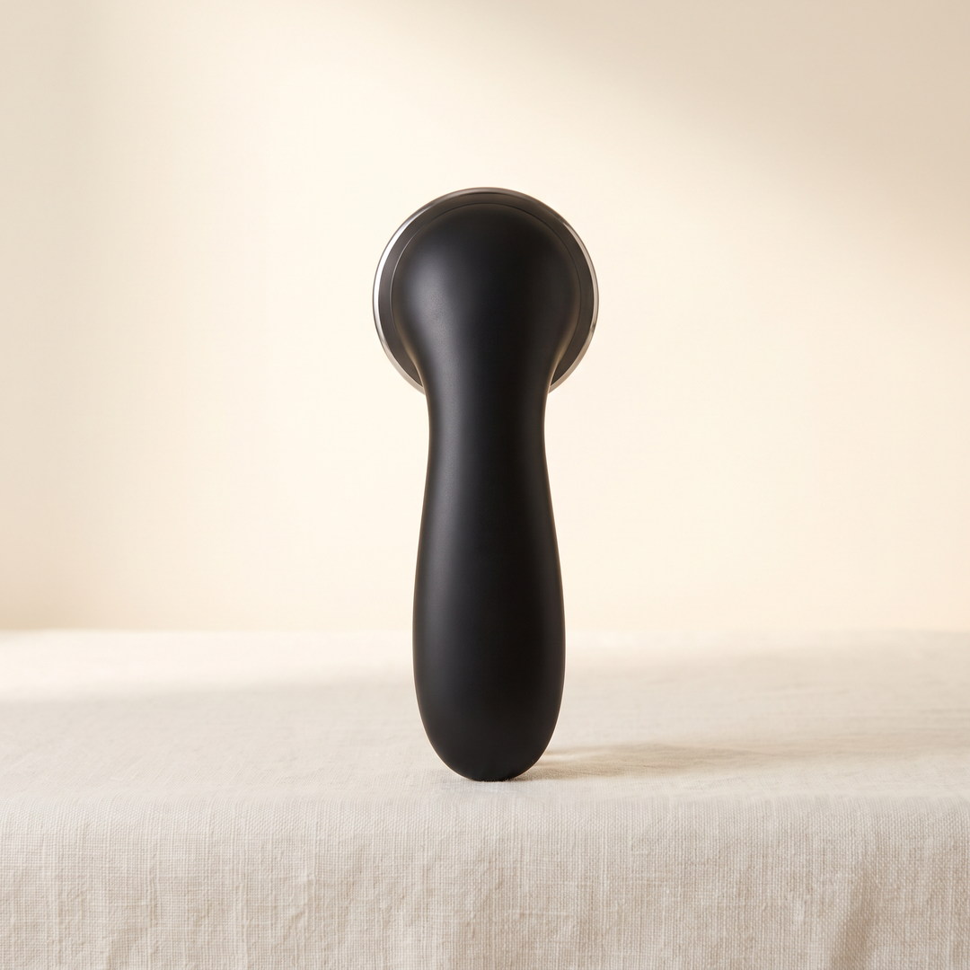 Black professional-grade skin massage device, front view, premium spa beauty tool