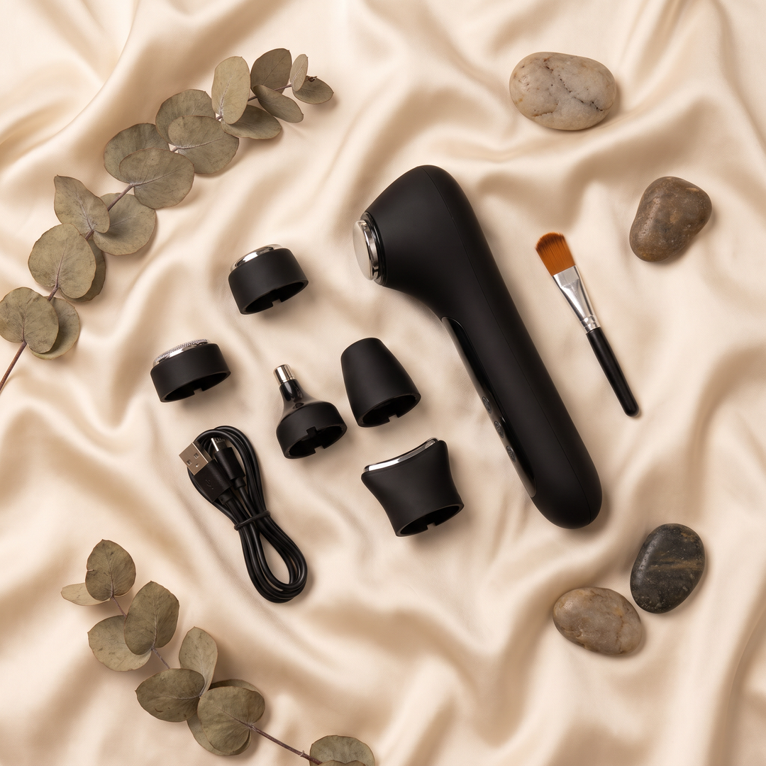 Black skin massage device kit with accessories, flat lay spa styling